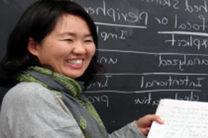 Student Smiling and Teaching 